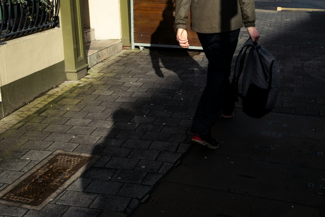 thief hiding clothes in bag